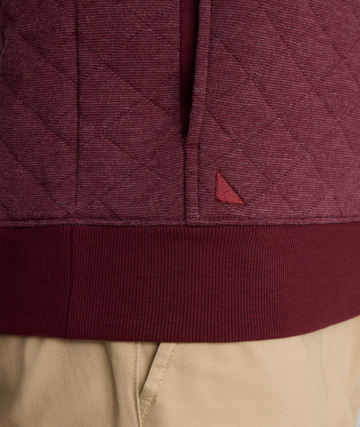 Model is wearing UNTUCKit Garrison Quilted Pullover in Tawny Port.