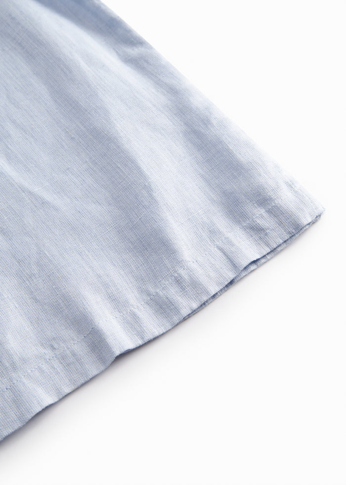 Sleeveless light blue top for children with lace details
