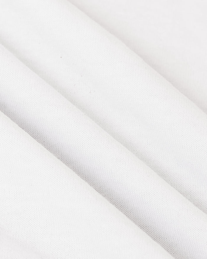 All White Tall Classic Polo 10-Pack, showcasing soft, fine-knit white fabric.