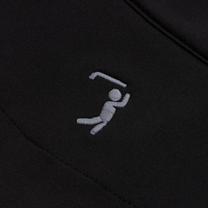 A close-up of the Black - Q-Zip’s moisture-wicking fabric shows an embroidered white stick figure swinging a bent object, suggesting sports action. The stitching and textured fabric are clearly visible.