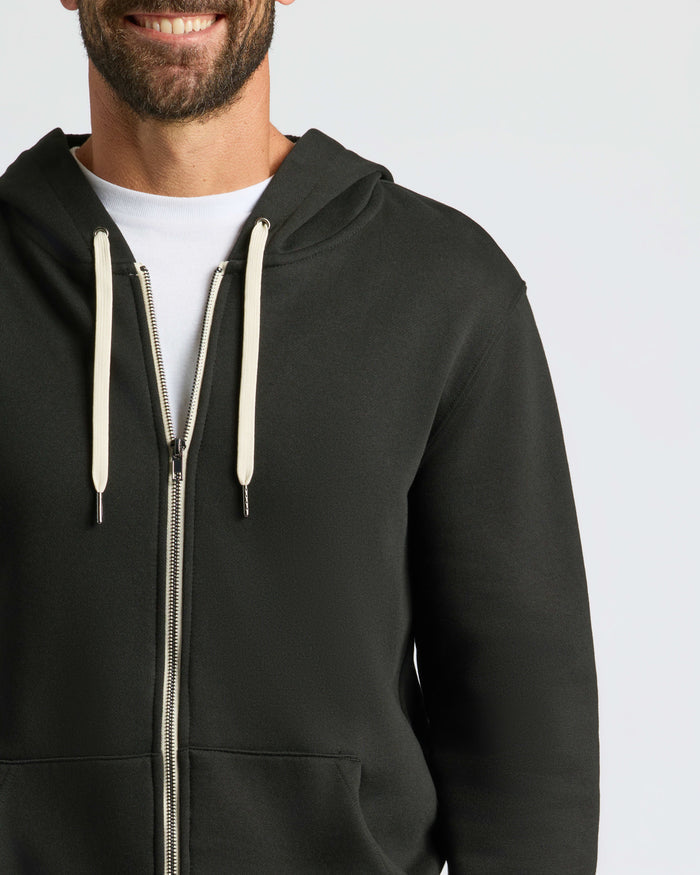 Man wearing Black Fleece French Terry Zip Hoodie.
