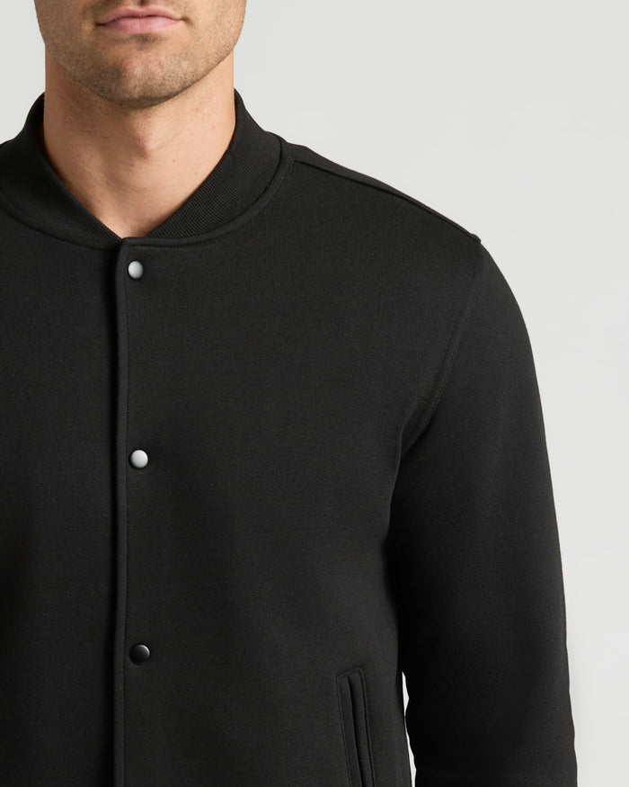 Black Fleece Bomber Jacket with snap-buttons and welt pockets.