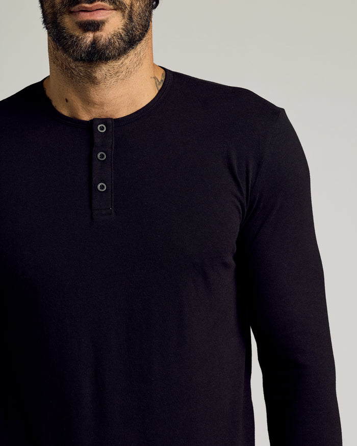 Black Tall Classic Long Sleeve Henley with button placket, worn by bearded man.