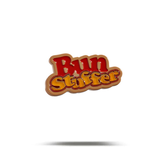 The Bun Stuffer - Ball Marker features playful retro-style orange and yellow lettering outlined in red, centered on white with a subtle drop shadow, and finished with durable iron nickel plating for extra shine.