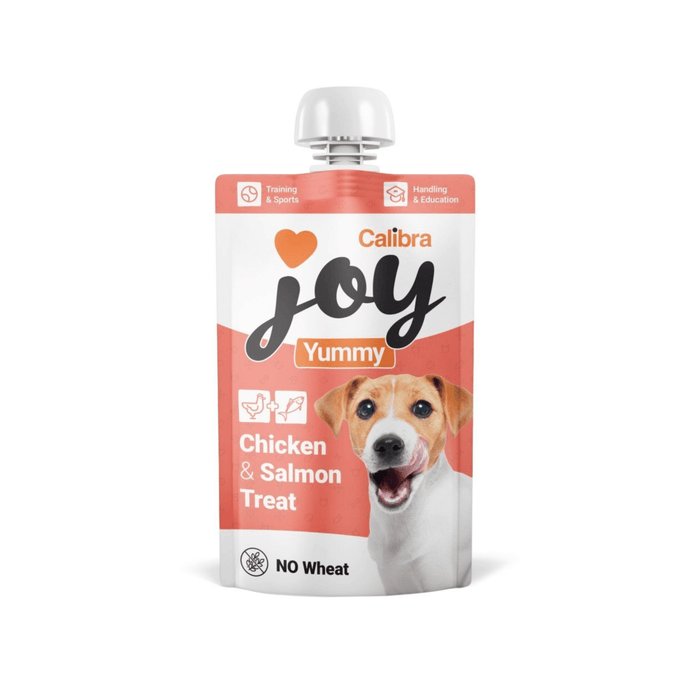 White background with a white and pink pouch of Calibra Joy Yummy paste treat in Chicken and Salmon flavour.