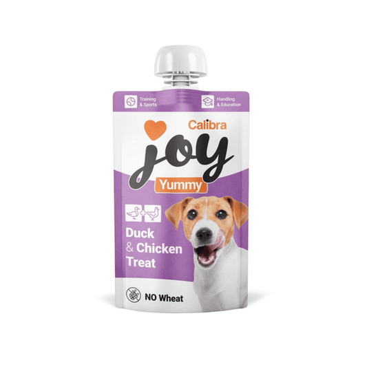 White background with a white and purple pouch of Calibra Joy Yummy paste treat in Duck and Chicken flavour.