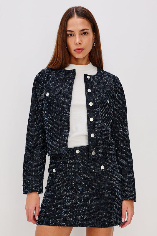 Capistrano Cropped Jacket in Denim Tweed Texture With Crew Neckline, Front Buttons, Buttoned Chest Pockets, and Long Sleeves in Denim Tweed Colorway - Upper Body Front View Featured on Model