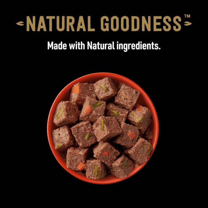 Black background with a red bowl of Cesar Natural Goodness Beef loaf pictured.