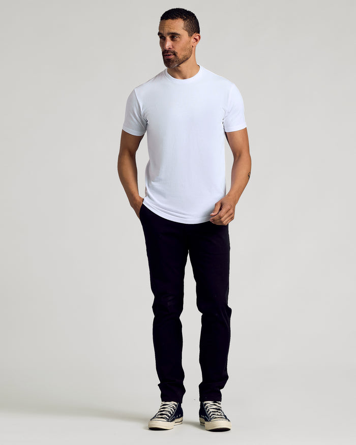 Man wearing Black & White Curved Hem Classic Crew Neck T-shirt.