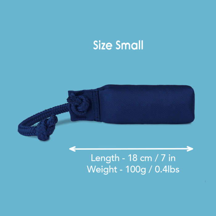 Blue background with a Small navy Coachi Training Dummy dog toy with a blue handle, with measurements below indicating length of 18cm.