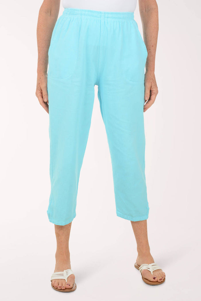 Person wearing light blue pants on a white background