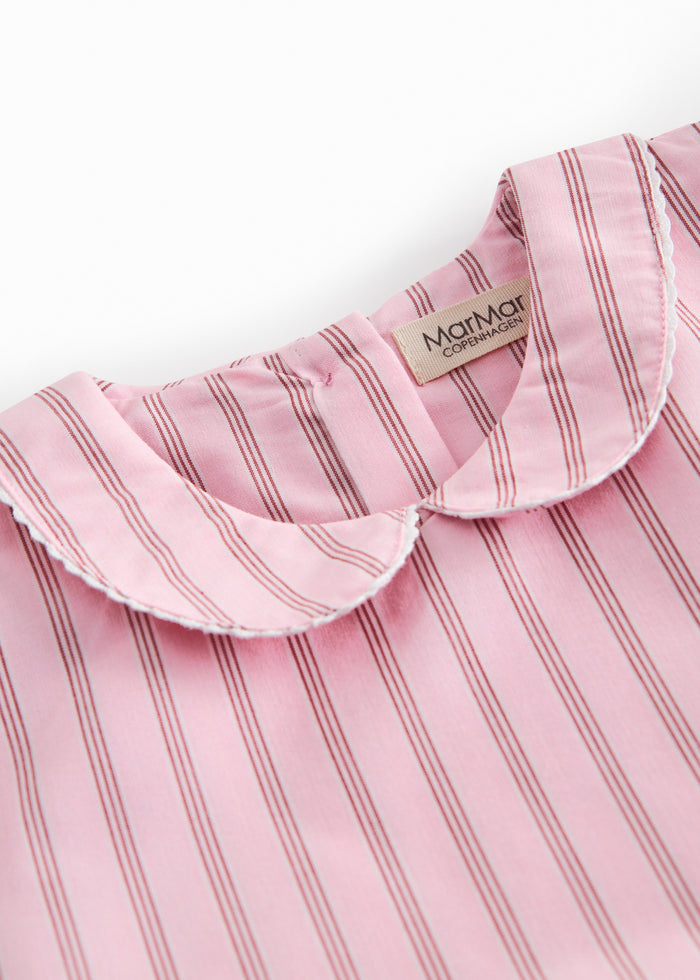 Short bright red dress with stripes for children, with a collar and picot edges, ribbon at the waist, and back zipper closure.