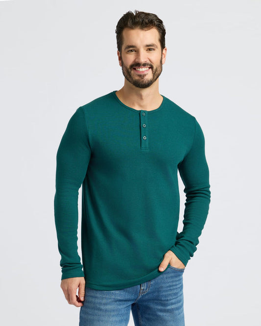 Man in Deep Emerald Waffle Long Sleeve Henley, hands in pocket.