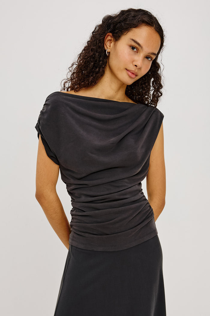 Dominic Top in Soft Jersey With Off-The-Shoulder One-Shoulder Design, Shirred Shoulders, and Ruched Waist in Ash Colorway - Upper Body Front View Featured on Model