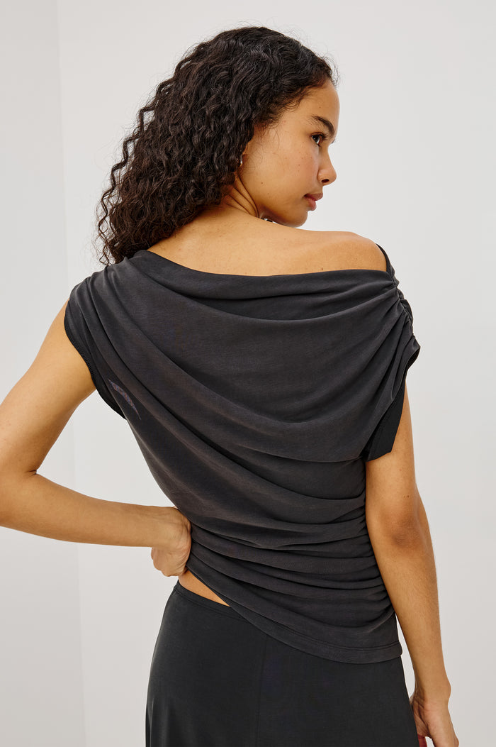 Dominic Top in Soft Jersey With Off-The-Shoulder One-Shoulder Design, Shirred Shoulders, and Ruched Waist in Ash Colorway - Upper Body Back View Featured on Model