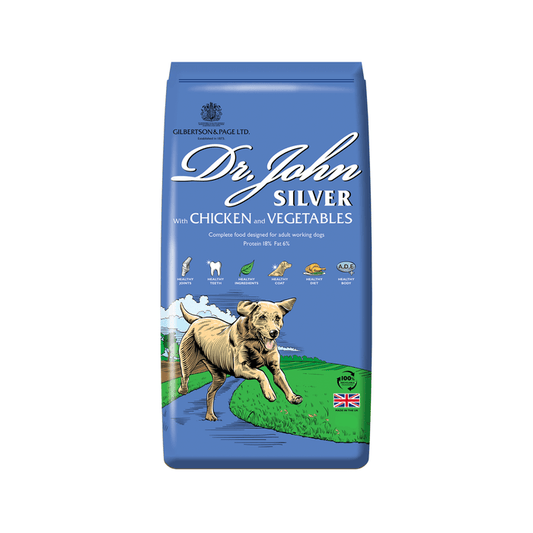 White background with a blue bag of Dr.John Silver Chicken and Vegetables dry food. Pictured on the bag is an illustrated Labrador dog in a farm field.