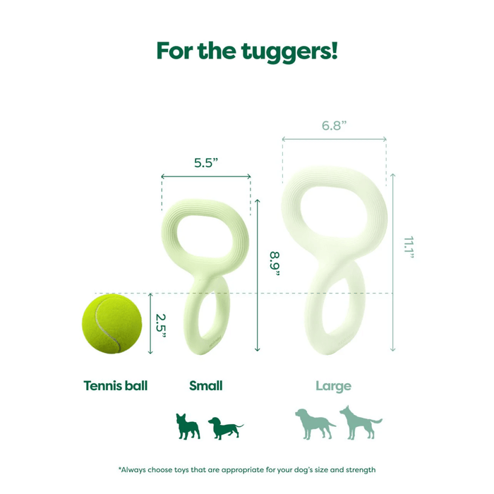 White background with a pale green Small Earth Rated Tug dog toy pictured next to a tennis ball for scale, with the larger toy greyed out. With measurements for both.