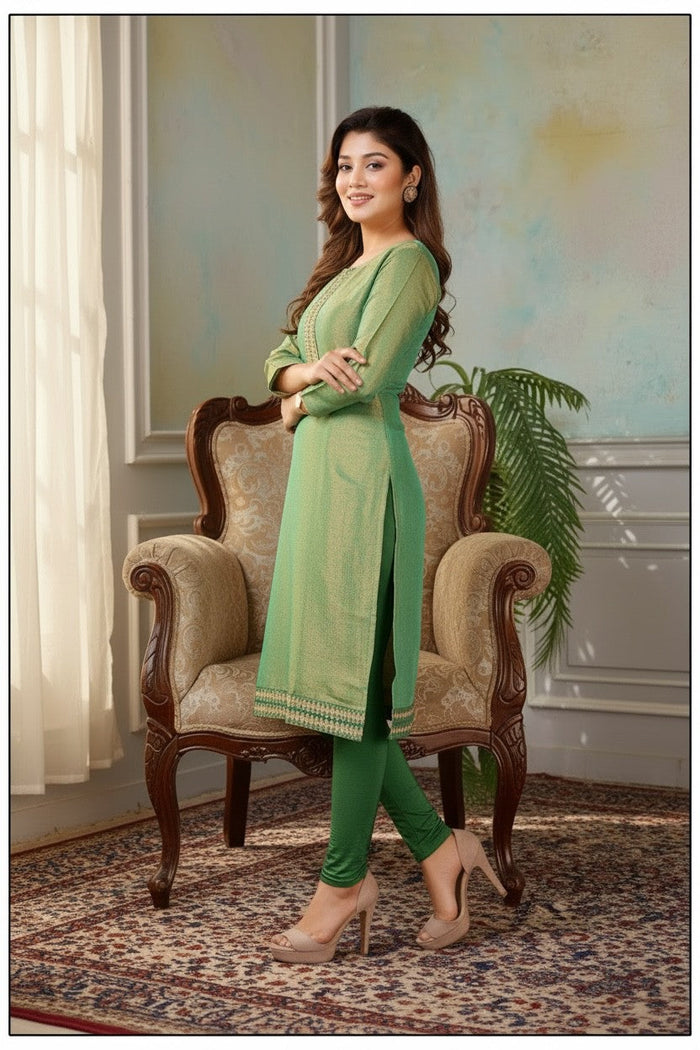 Kurti Connection USA sage green tissue silk kurti with intricate embroidery, three-quarter sleeves, and side slits.