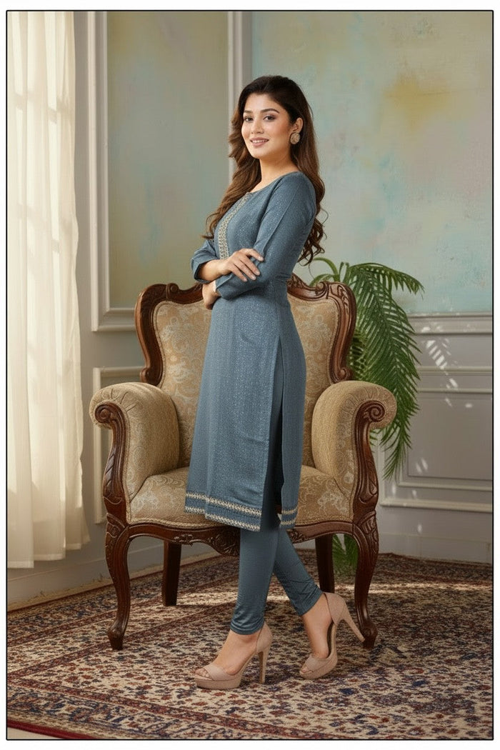 Model wearing a blue Kurti Connection USA tissue silk kurti with intricate embroidery, styled with matching leggings.