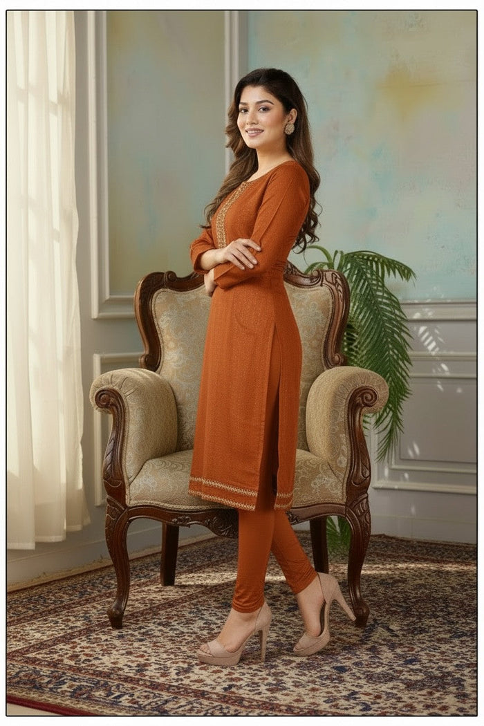 Kurti Connection USA rust orange tissue silk kurti with intricate embroidery, side slits, and matching leggings.