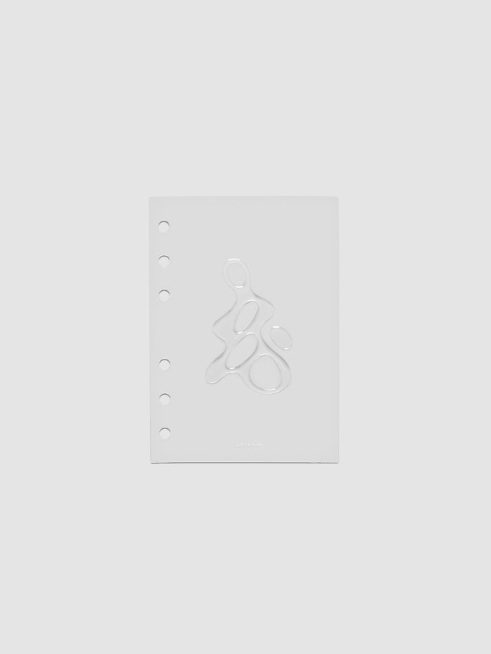 Light grey, semi-transparent, and glossy plastic planner dashboard with organic raised shape design in size A6 on a neutral background.