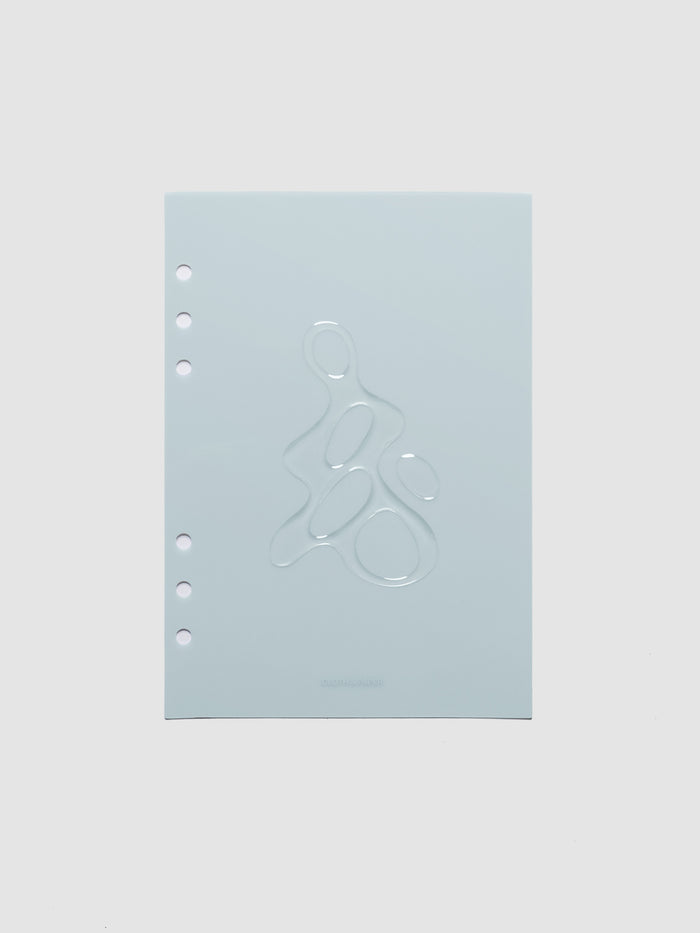 Light blue, semi-transparent, and glossy plastic planner dashboard with organic raised shape design in size A5 on a neutral background.