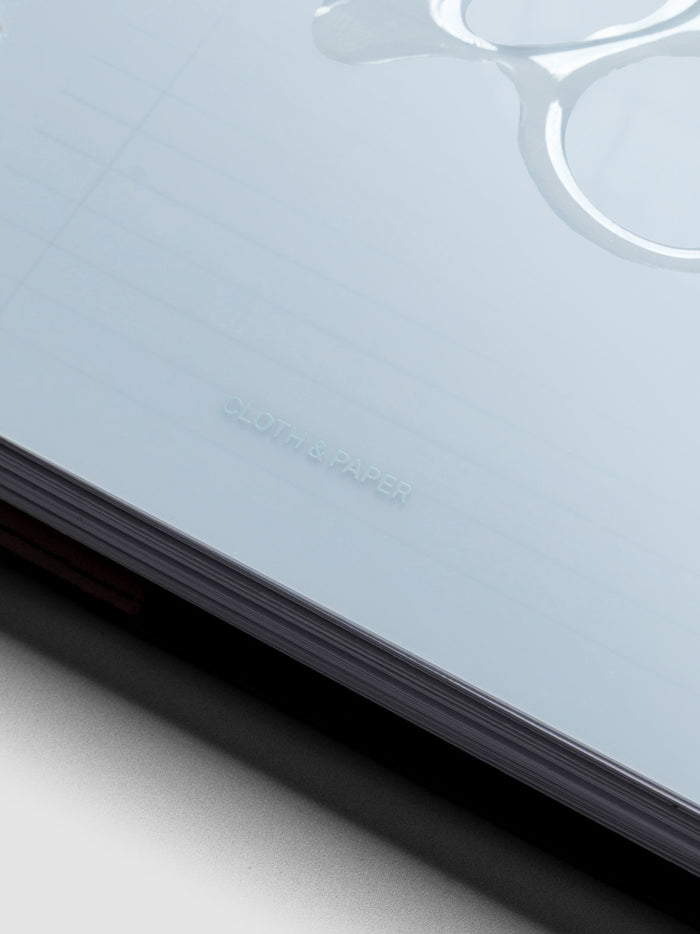 Close up image of the Gloss Form Dashboard in Smoked Salt showing the Cloth & Paper logo.
