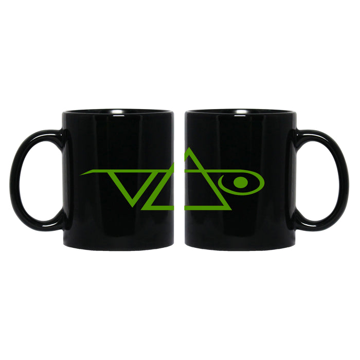 Image of a black coffee mug against white background. the mug has the steve vai logo in it in green.  The steve vai logo makes the word "vai" with an upside down triangle, a right side up one, and a line going across the triangles with a curl at the end next to the triangle that is upright.
