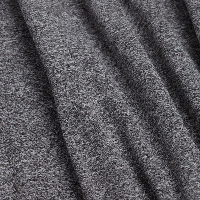 A close-up of the Heather Gray - Q-Zip shows soft, heathered fabric with visible texture and subtle folds. The thick, cozy material offers moisture-wicking properties for warmth and comfort.