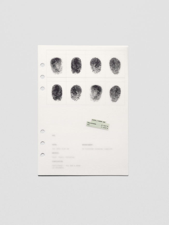 Two layered A5 sized planner dashboards, one semi-transparent, one matte, featuring a fingerprint design.