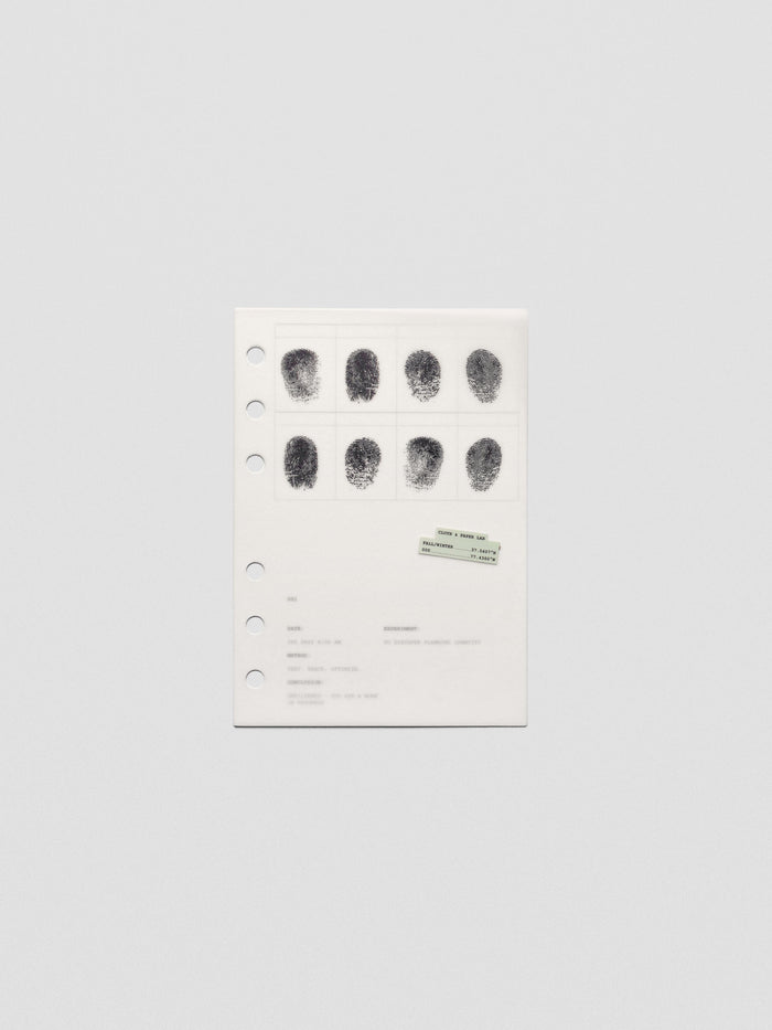 Two layered A6 sized planner dashboards, one semi-transparent, one matte, featuring a fingerprint design.