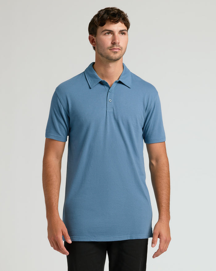 Indigo Short Sleeve Tall Polo worn by young man, showcasing fit.