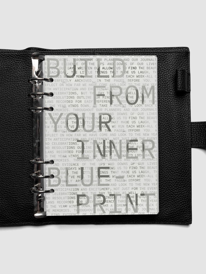 Inner Blueprint Dashboard Duo shown ring bound in a black leather agenda in size A5.