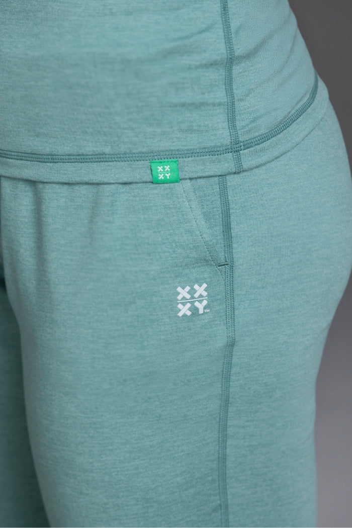 Teal leggings with a brand logo on a plain background || Underseas