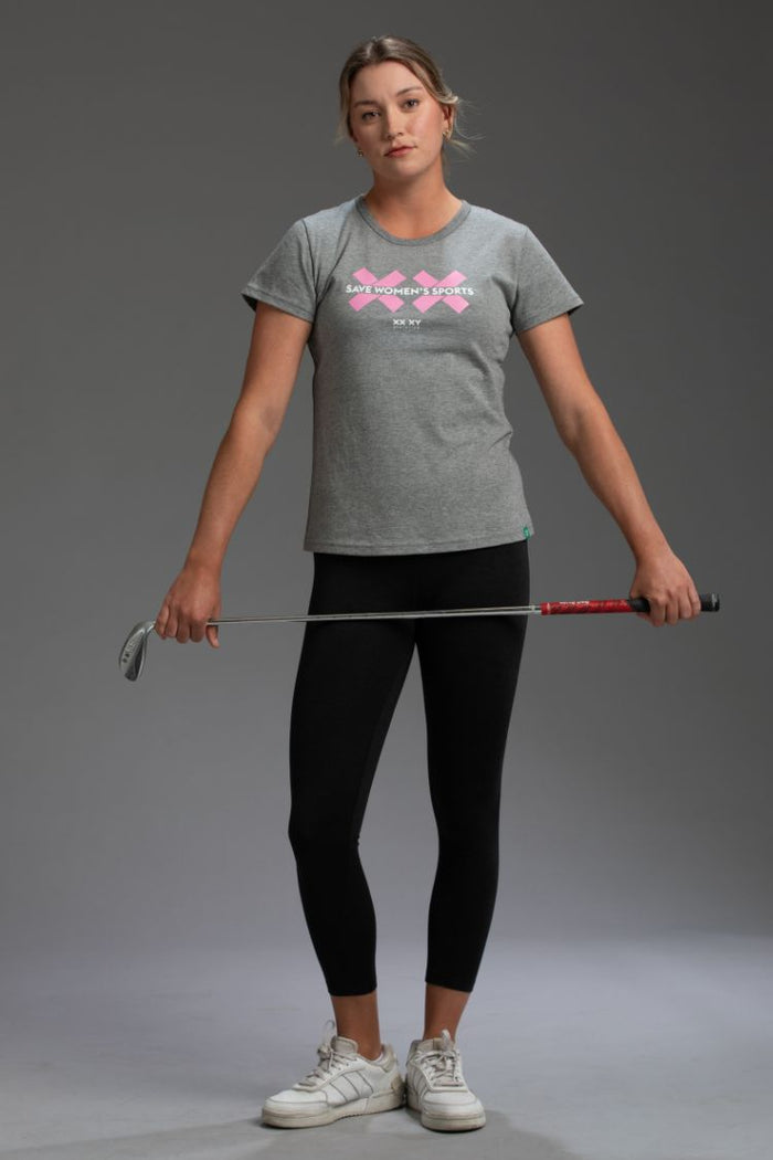 Woman holding a juggling club against a gray background || Black Heather