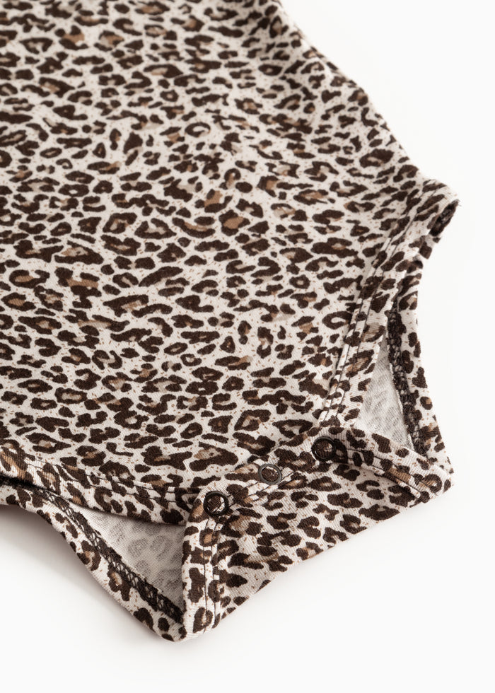 Leopard-patterned dark brown body with buttons at the leg opening.