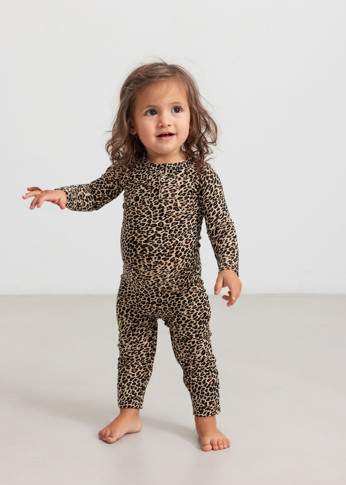 Girl in leopard print jumpsuit