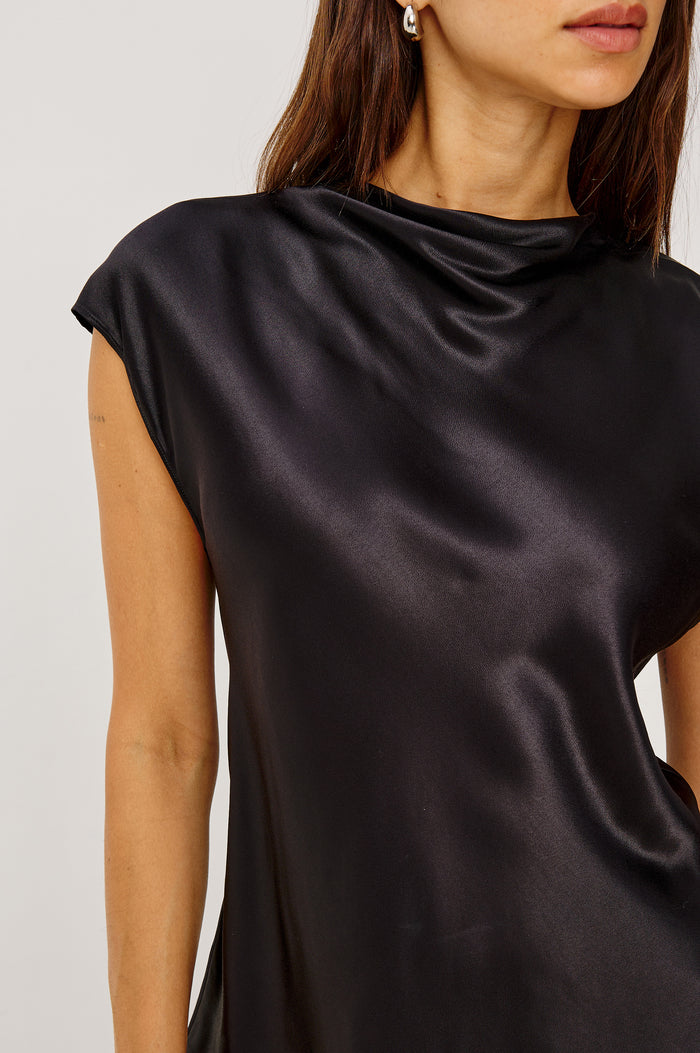 Loretta Top in Satin Back Crepe With a Loose Fit, Cowl Neckline, Cap Sleeves, and a Back Keyhole Button Cutout in Black Colorway - Upper Body Close Up Front View Featured on Model