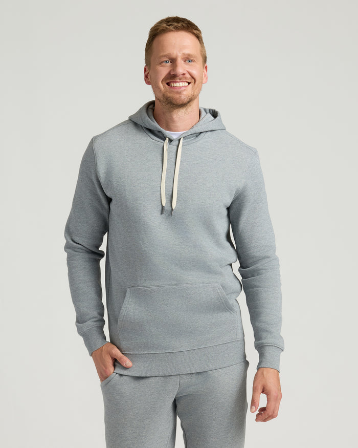 Medium Heather Gray Tall Fleece French Terry Pullover Hoodie on smiling man.