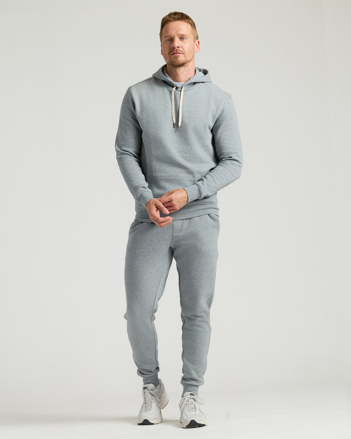 Medium Heather Gray Tall Fleece French Terry Pullover Hoodie on man standing.