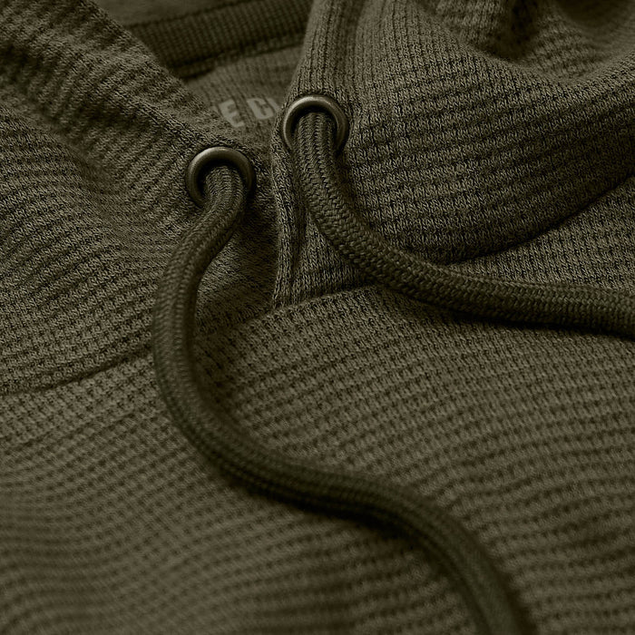 Military Green Waffle Hoodie close-up showing textured fabric and drawstring.