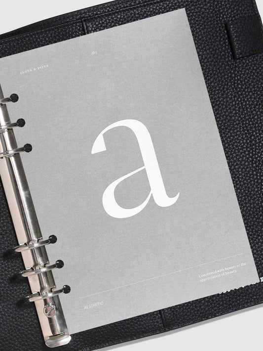 Monogram Vellum Planner Dashboard A in use in a leather planner.
