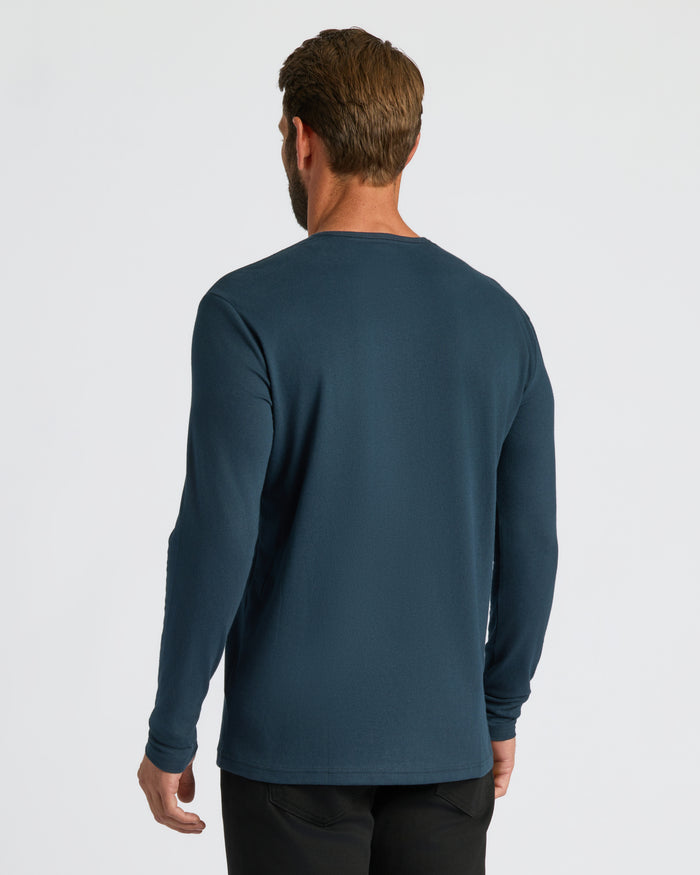 Man wearing Navy Classic Long Sleeve Henley, showcasing back fit and cut.