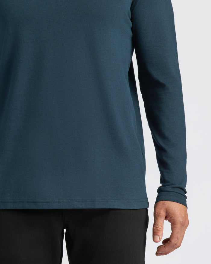 Navy Classic Long Sleeve Henley worn with black pants.