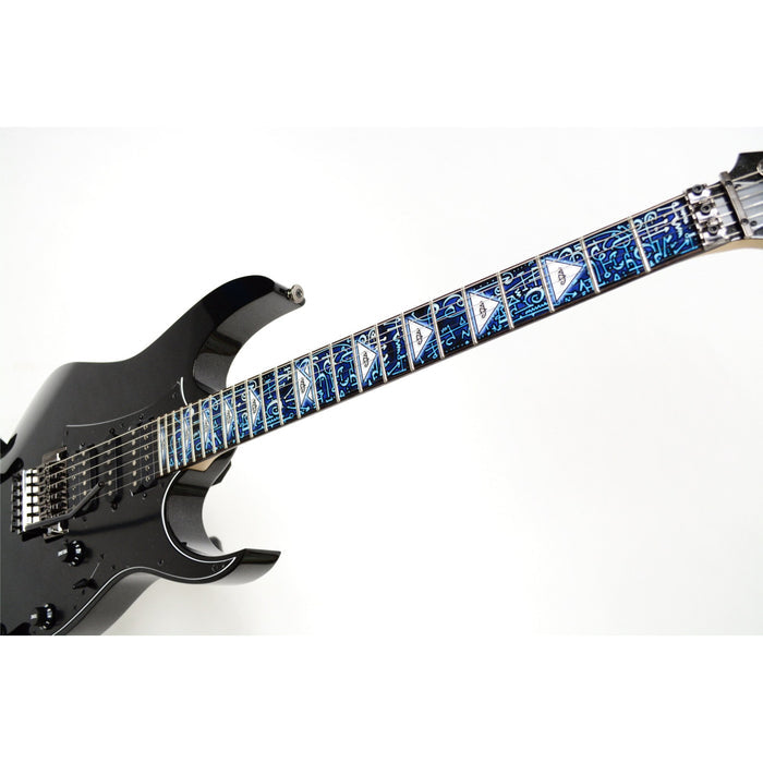image of guitar with a fret protector on it against a white background. it has a lot of abstract shapes in black, white, and light blue. some of the spaces have white triangles with a black outline with the steve vai logo in the center. The steve vai logo makes the word "vai" with an upside down triangle, a right side up one, and a line going across the triangles with a curl at the end next to the triangle that is upright.