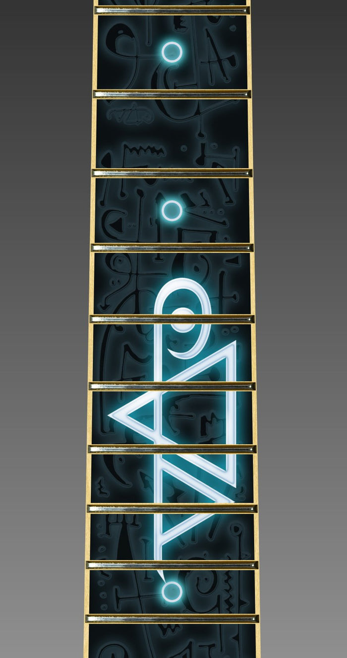 up close image of a fret protector that is black with dark colored symbols throughout. descending from the center of the fret protector is a glowing light blue and white steve vai logo.  The steve vai logo makes the word "vai" with an upside down triangle, a right side up one, and a line going across the triangles with a curl at the end next to the triangle that is upright.