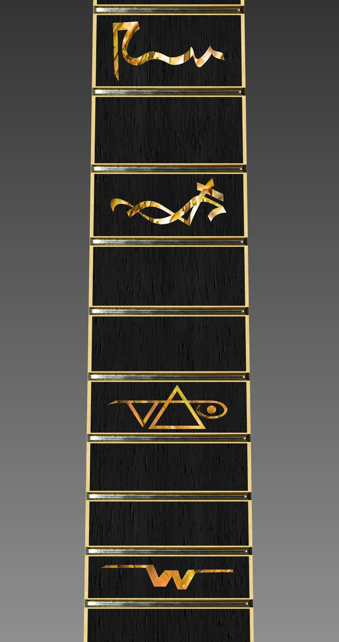close up image of a guitar neck against a grey background. there is a fret protector on the guitar. It is black with multi-color symbols on nearly every other fret. One fret has the steve vai logo on it. The steve vai logo makes the word "vai" with an upside down triangle, a right side up one, and a line going across the triangles with a curl at the end next to the triangle that is upright.