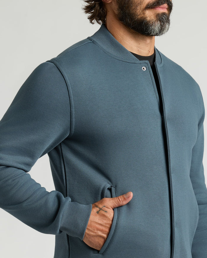 Neptune Fleece Bomber Jacket with pocket detail and tattooed thumb.