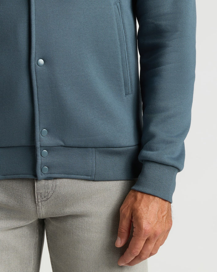 Neptune Fleece Bomber Jacket showing side pockets and ribbed cuffs.