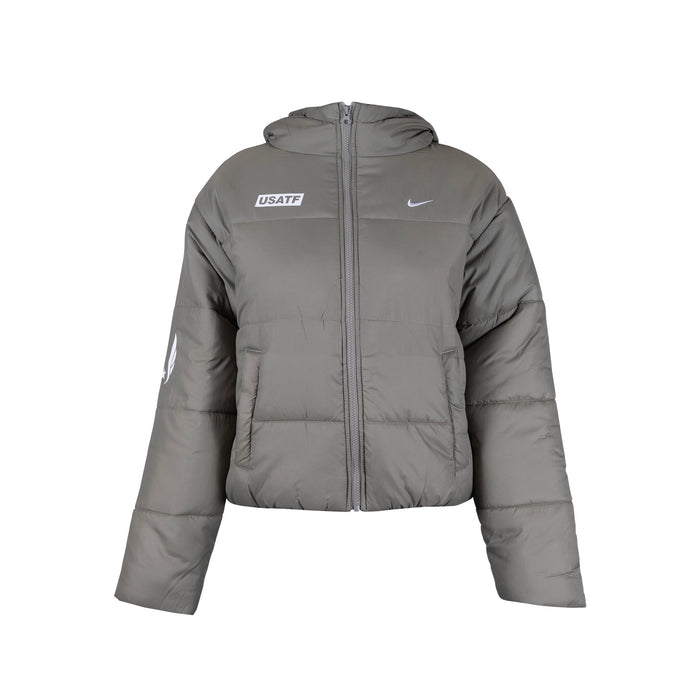 A hooded Nike Therma-FIT jacket in beige, designed for cold-weather conditions with synthetic insulation and water-repellent finish.
